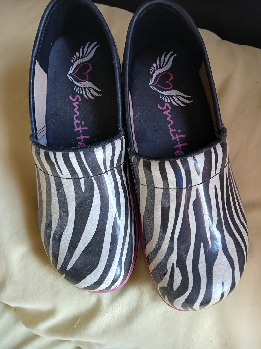 Womens Zebra-Print Slip-On Clogs in Black and White